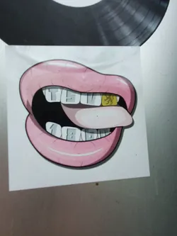 A sticker depicting a cartoon mouth with gold teeth. One tooth has the TSV 1860 München logo. The text on the other teeth spells out TSV 1860.