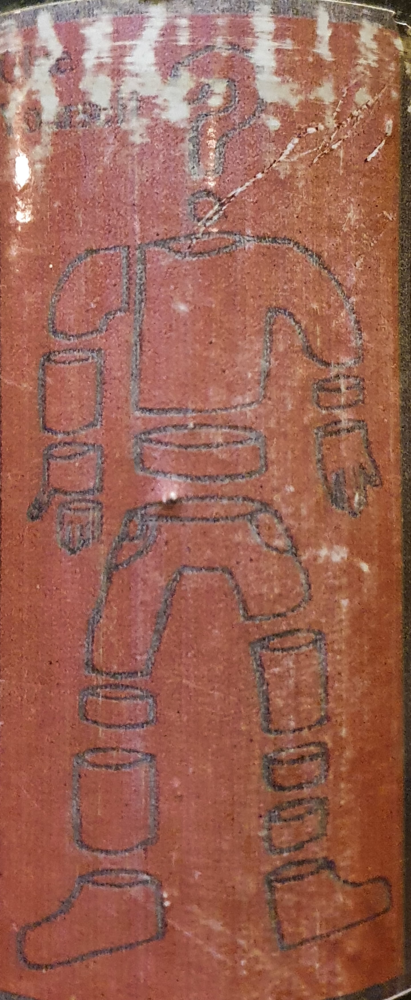 Reddish-brown sticker depicting a robot figure disassembled into segments. The style is minimalistic and somewhat crude. The robot appears humanoid, with separate pieces for the head, torso, arms, and legs.