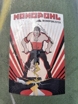 A sticker featuring soviet-style propaganda artwork. A man is depicted using a jackhammer to destroy a vinyl record. The text \"МОНОПОЛ\" and \"MONOPOHLISTEN\" is visible. 