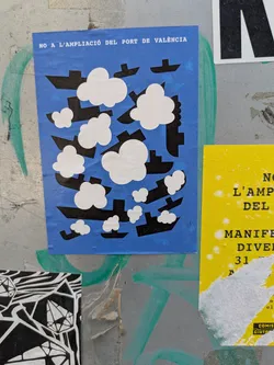 This sticker features a blue background filled with a repeating pattern of black stylized ships and white cloud shapes. The text "NO A L'AMPLIACIÓ DEL PORT DE VALÈNCIA" is printed at the top, indicating opposition to the expansion of the Port of Valencia.