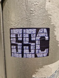 A square sticker with a design resembling a brick wall pattern. The letters 'HSC' are prominently featured in a stylized font within the brickwork.