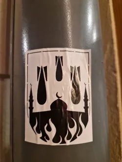 This sticker shows a black and white image of three bombs falling on a mosque that is on fire. The style is simple and bold.