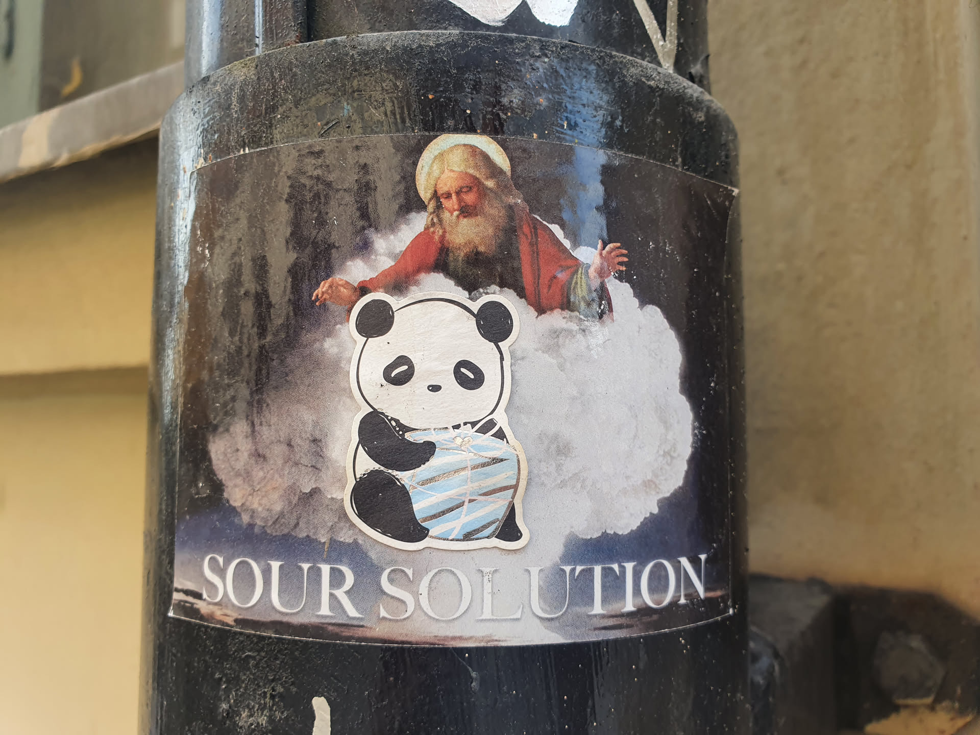 A sticker featuring a cartoon panda sitting on a cloud with God in the background. The text 'SOUR SOLUTION' is at the bottom of the sticker. 