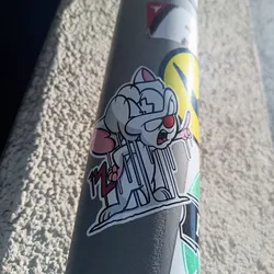 A vinyl sticker featuring a stylized illustration of Pinky from the cartoon series Pinky and the Brain.  Pinky is depicted in a doctor's outfit, appearing slightly deranged and holding a lollipop. The art style is clean and modern with a focus on bold lines.
