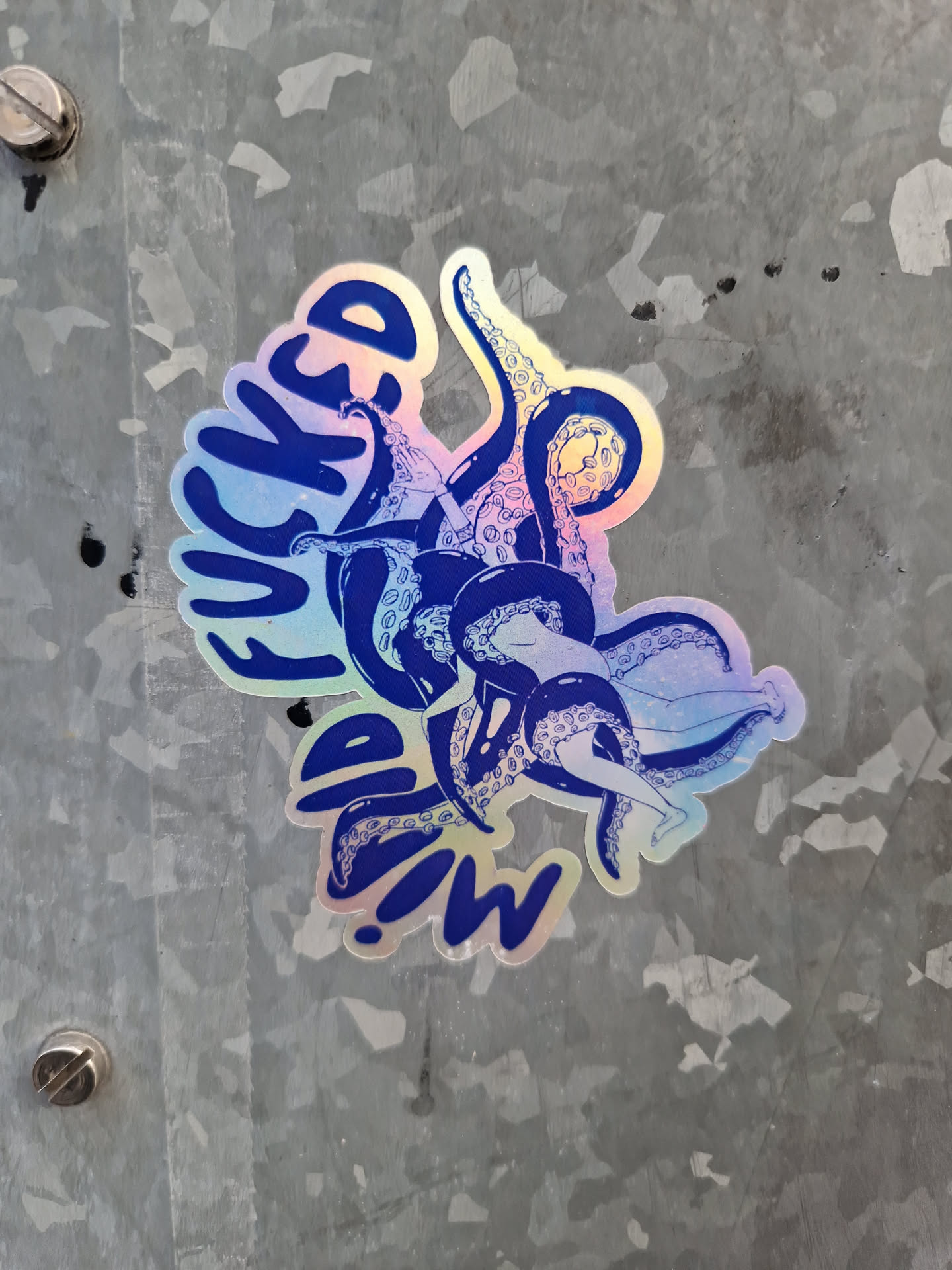 Holographic sticker of an octopus with the text "Wicked Squid!" in blue. The sticker has an iridescent finish.