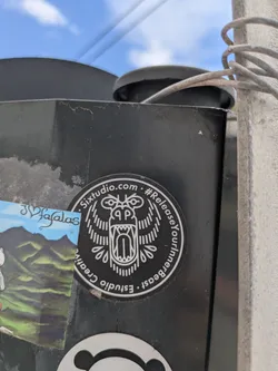 The round sticker features a stylized roaring beast design in white against a black background. It includes the website 'Sixtudio.com' and the hashtag '#ReleaseYourInnerBeast' printed around the edge. The artwork is clean and minimalist.