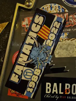 A sticker commemorating Fanatics from 1988 to 2022. It features a blue dragon-like creature and the flag of Catalonia.