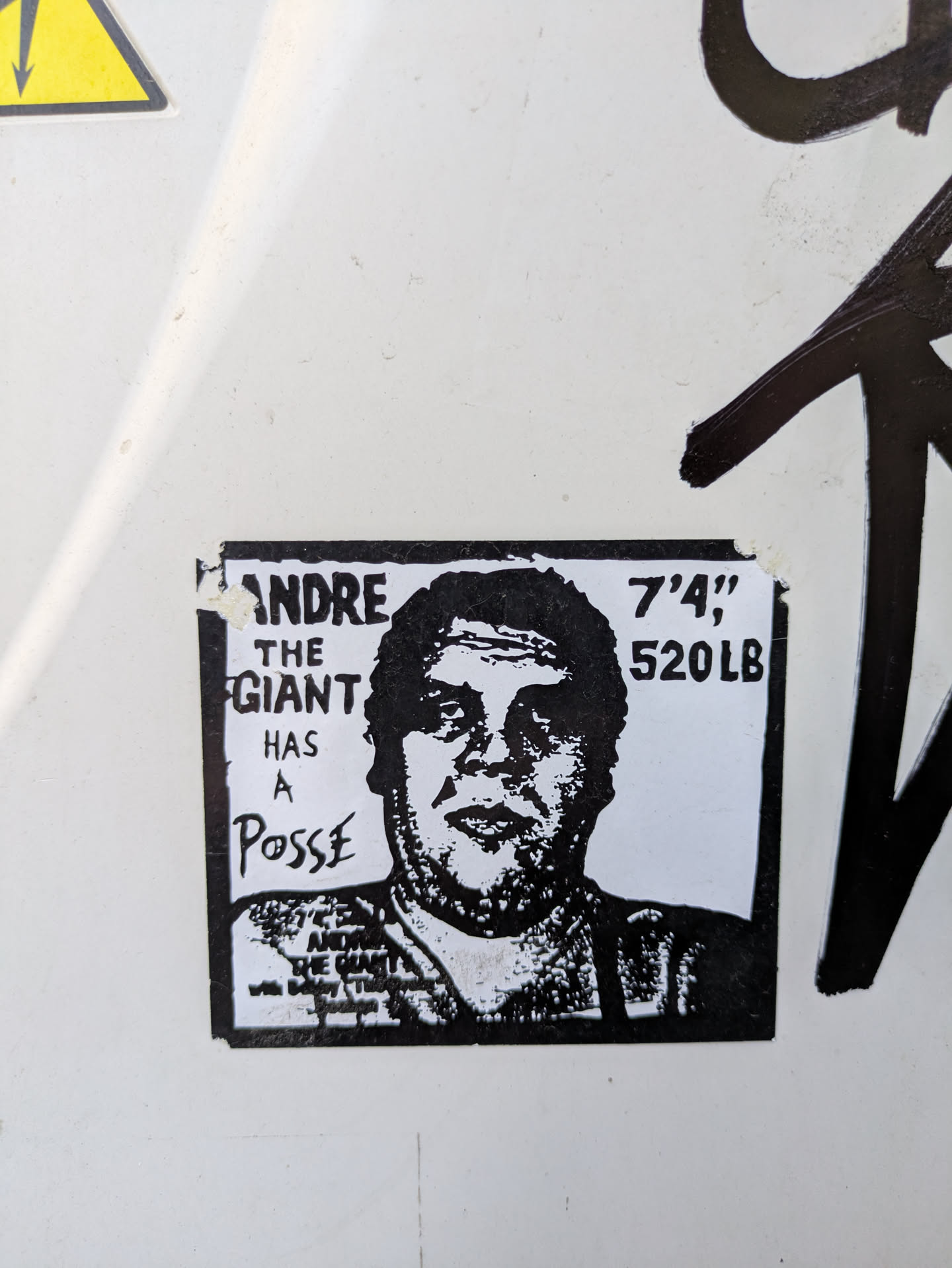 A black and white sticker featuring Andre the Giant with the text "ANDRE THE GIANT HAS A Posse" and "ANDRE THE GIANT with Bobby The Brain Heenan".