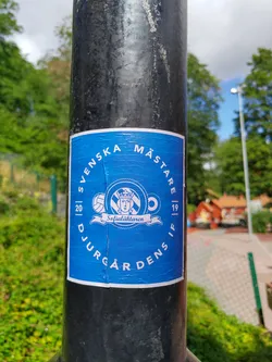 A blue sticker celebrating Djurgården's Swedish Championship win in the 2019-2020 season. It features the team's logo and the text 'Svenska Mästare' (Swedish Champions) and 'Djurgårdens IF'.