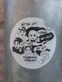 A black and white illustration sticker with diverse people, promoting peace and hope. It says  "Better to light a candle than to curse the darkness" in Swedish.