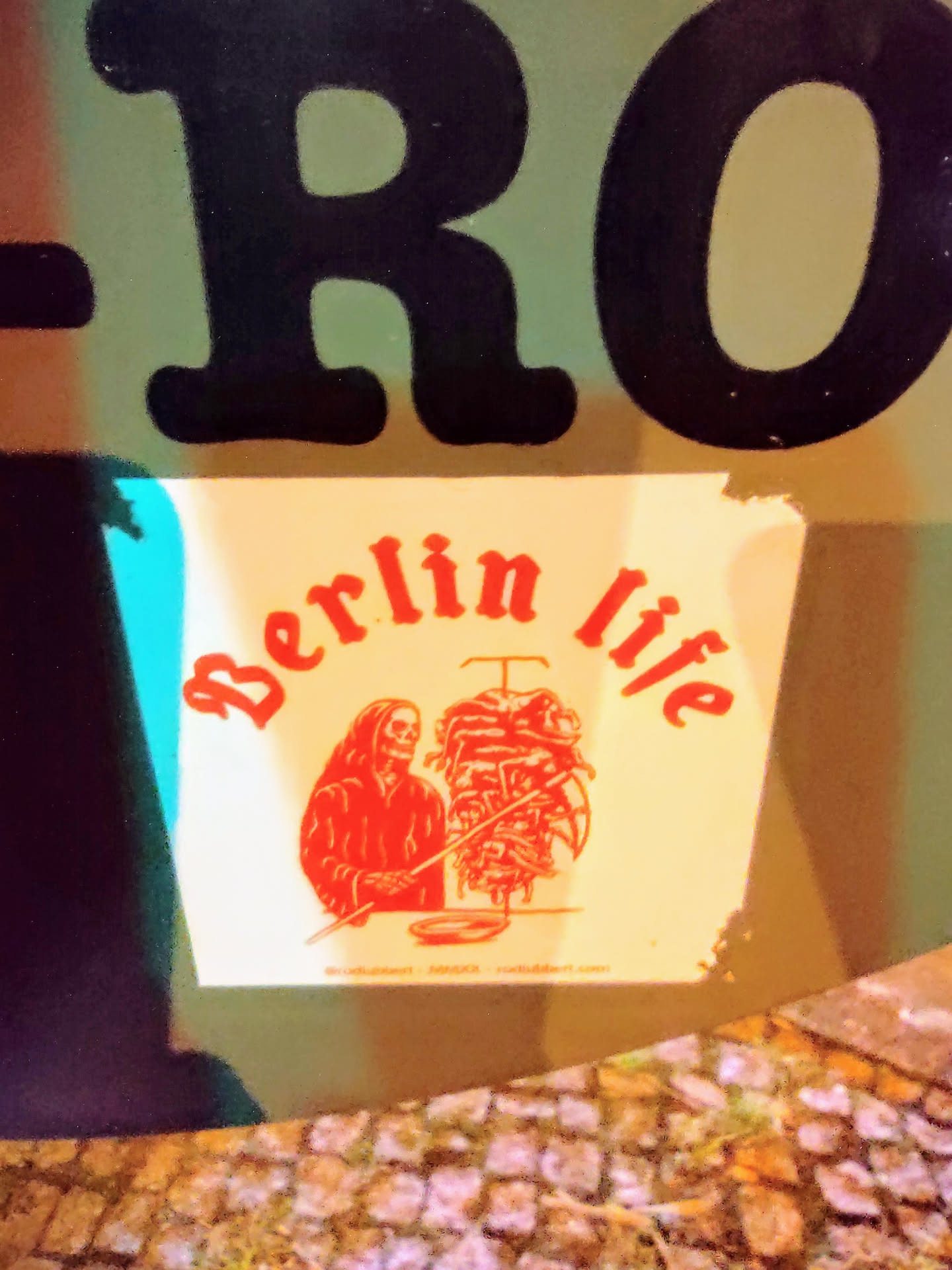 A sticker featuring a grim reaper grilling a kebab.  The text 'Berlin life' is prominently displayed. The sticker has a website address at the bottom.