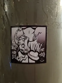 A black and white sticker with a drawing of a body with an octopus wrapping around it. The text on the sticker says "GOODBYE HORSES TAT TOO".