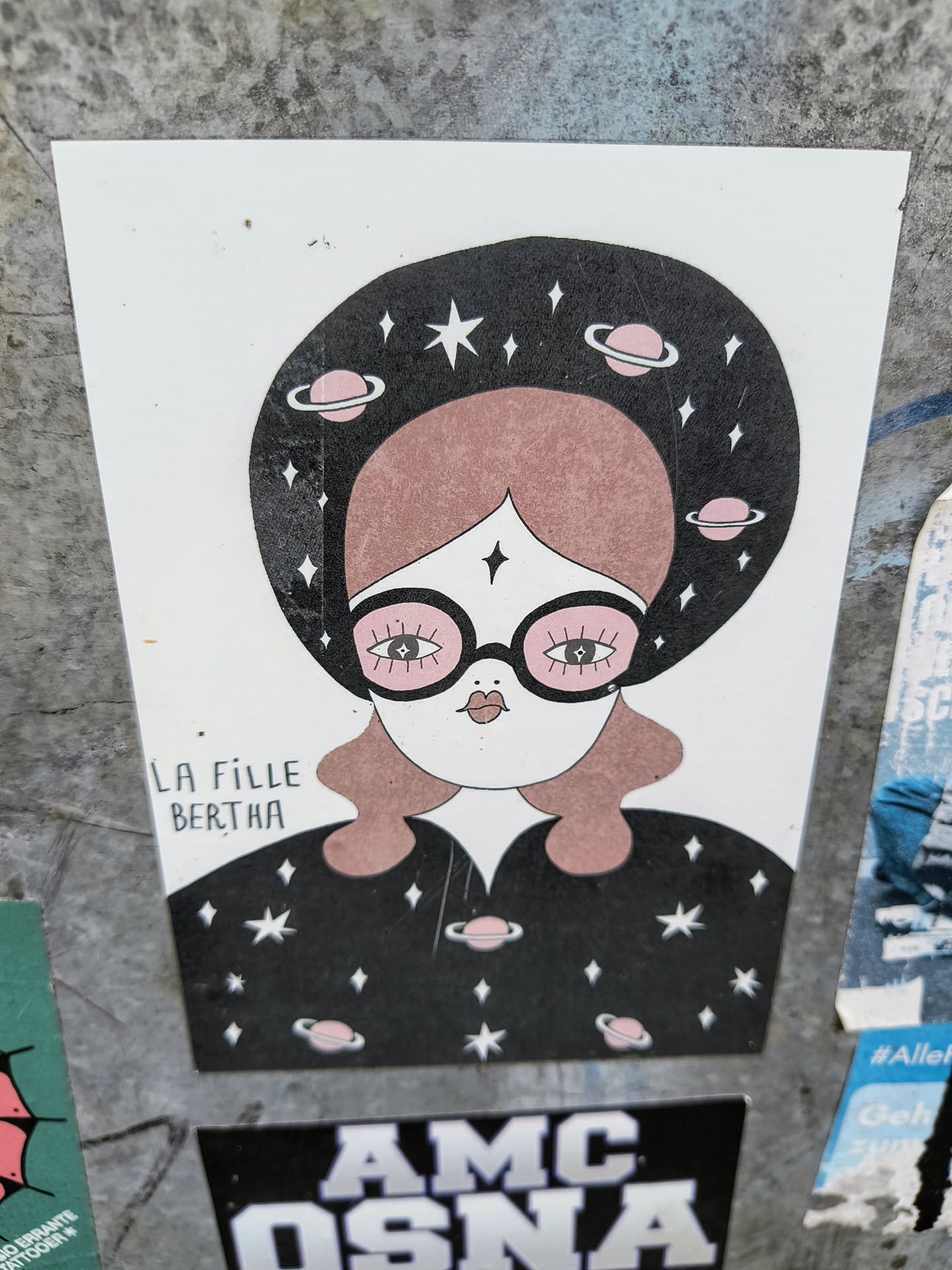 A sticker featuring a girl with pink hair and glasses, wearing a space-themed outfit and headpiece adorned with stars and planets.