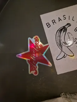 A holographic red star sticker with the words \"Active Boss\" written in a cursive style. The sticker has a slightly iridescent finish, giving it a shiny appearance.