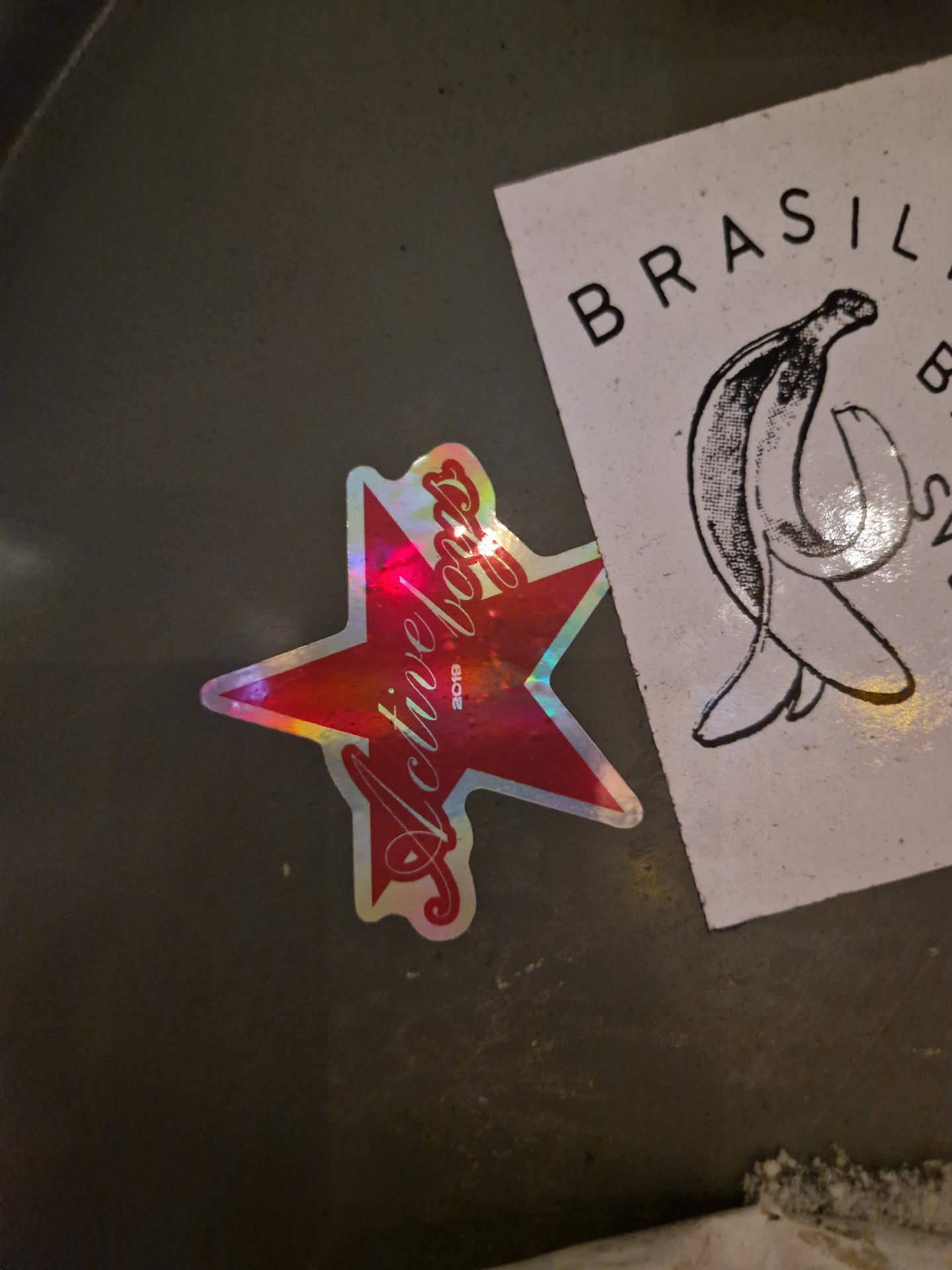 A holographic red star sticker with the words \"Active Boss\" written in a cursive style. The sticker has a slightly iridescent finish, giving it a shiny appearance.
