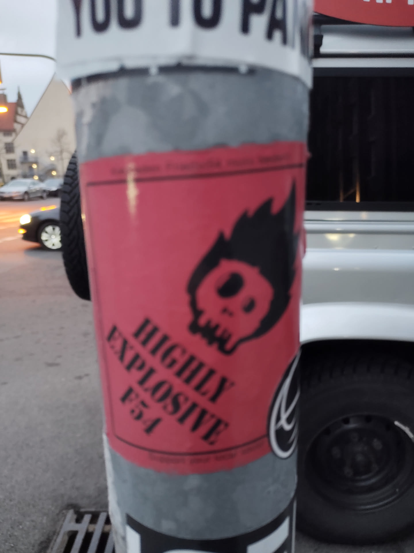 A red sticker with a skull engulfed in flames and the text "Highly Explosive F54".