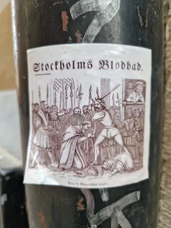 A sticker depicting the Stockholm Bloodbath of 1520.  The image shows a historical illustration of the event, featuring figures in period clothing. The text 'Stockholms Blodbad' and 'Den 8 November 1520' are visible.