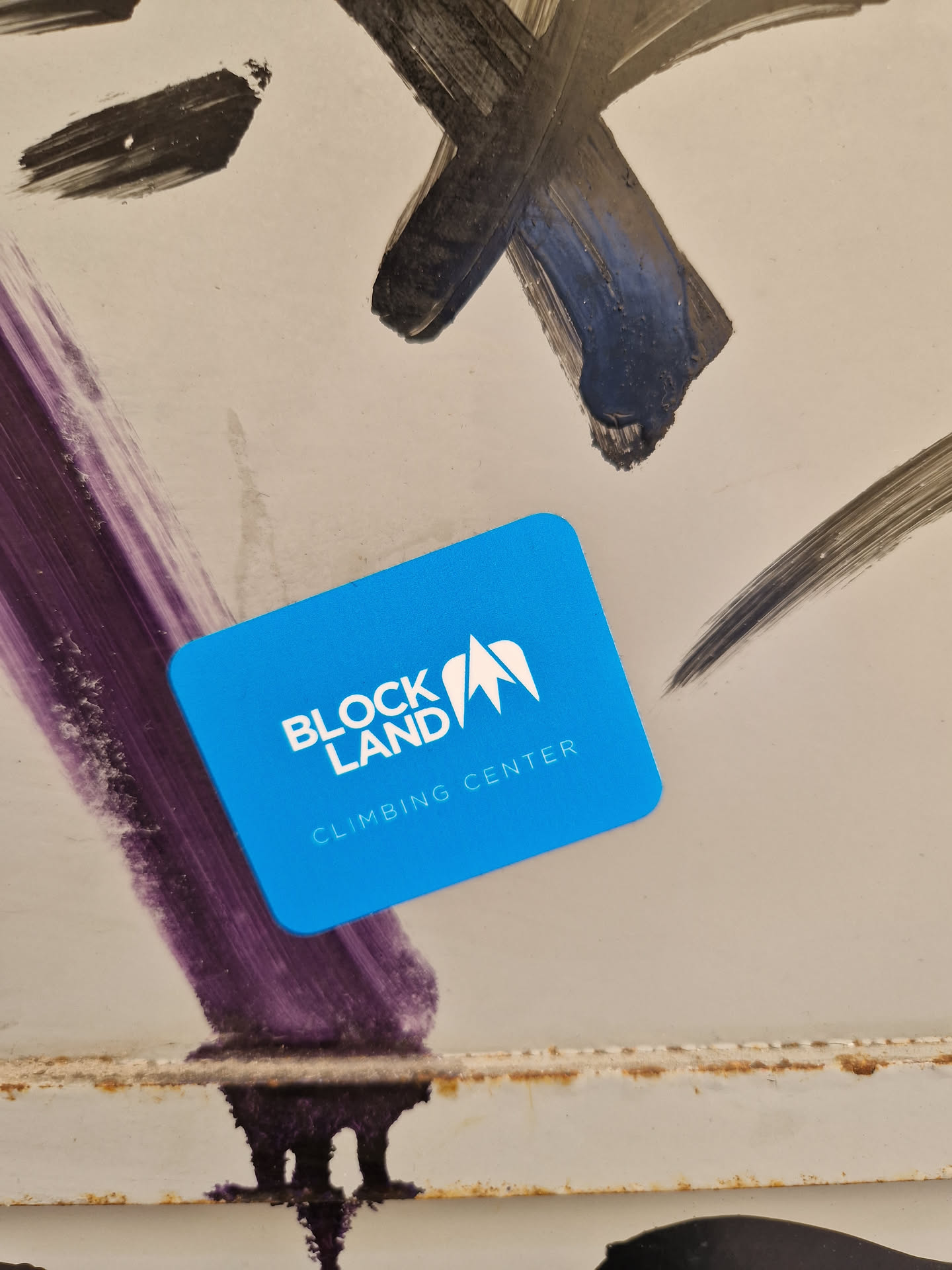 A bright blue square sticker for Block Land Climbing Center.  It features the logo with a mountain peak graphic and text.