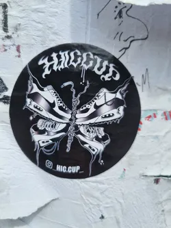 Black and white sticker of a butterfly made of Nike Air Max 90 shoes. The word HIC CUP is written in a stylized font at the top. The sticker has a dripping effect and the Instagram handle @HIC.CUP_ is visible at the bottom.
