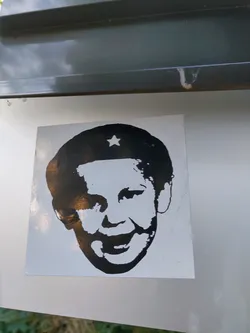 Black and white sticker of Che Guevara with a star on his hat. It's a simple, bold design that makes a statement.