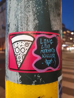 A sticker featuring a pizza slice graphic and the text 'Long Live Mermaid Killer'. The sticker is pink and black with white outlines.
