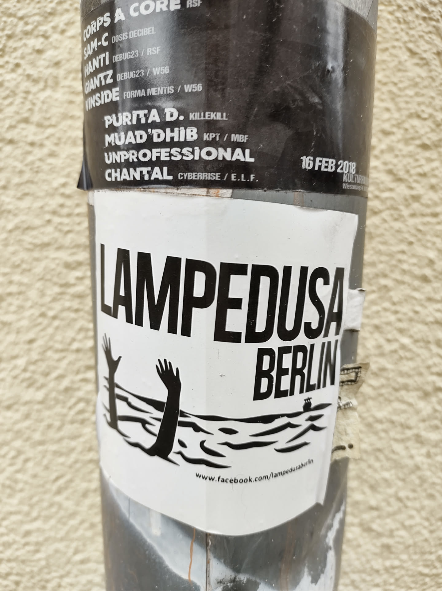 Black and white sticker with an illustration of two hands reaching out of the water.  The text 'Lampedusa Berlin' is prominently displayed. A Facebook link is visible at the bottom.