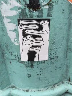 This sticker features a captivating design of several abstract figures intertwined together, creating a sense of unity and connection. The style is minimalist, with only black lines on a white background, lending a clean and modern feel. The figures have simple, almost childlike features, which adds a touch of whimsy. The overall impression is one of playfulness and subtle mystery, drawing the viewer into its abstract narrative.