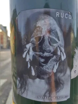 A monochrome sticker featuring a close-up of a stylized face, seemingly weeping. The style is dark and slightly unsettling. The artist's name, RUCO, is printed at the top, and their Instagram handle is at the bottom. 