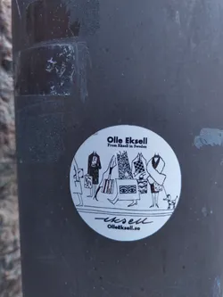 Round sticker featuring a black and white illustration of people shopping, carrying bags, and a small dog. The artist's name and website are included at the bottom.
