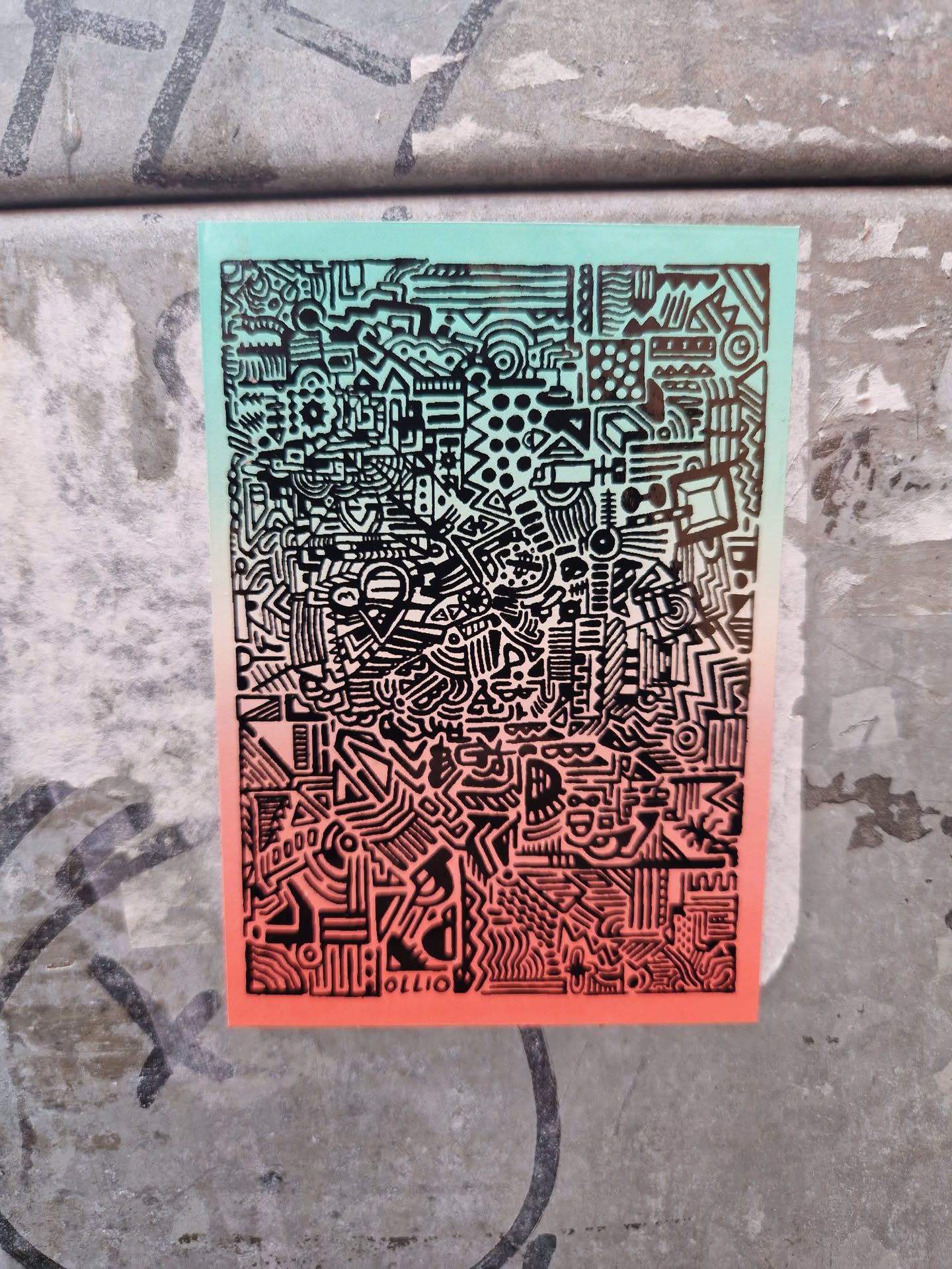 A sticker featuring a complex, detailed black and white doodle pattern on a teal to coral gradient background. The style is reminiscent of intricate, interwoven geometric shapes and symbols.  The bottom right corner has a small, barely visible signature or artist mark that may read 'OLLIO'.