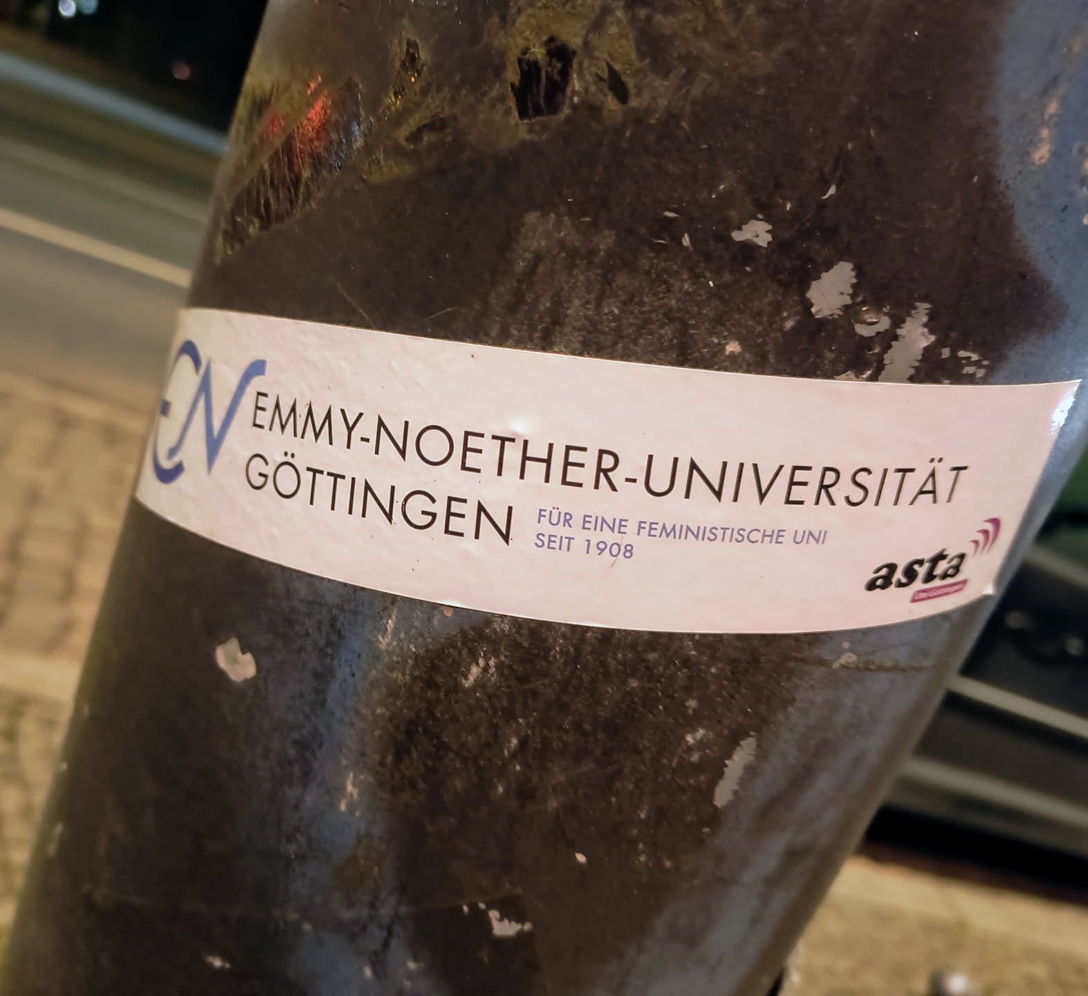Sticker promoting Emmy Noether University in Göttingen, advocating for a feminist university since 1908.  The sticker includes the university's logo and the asta logo.