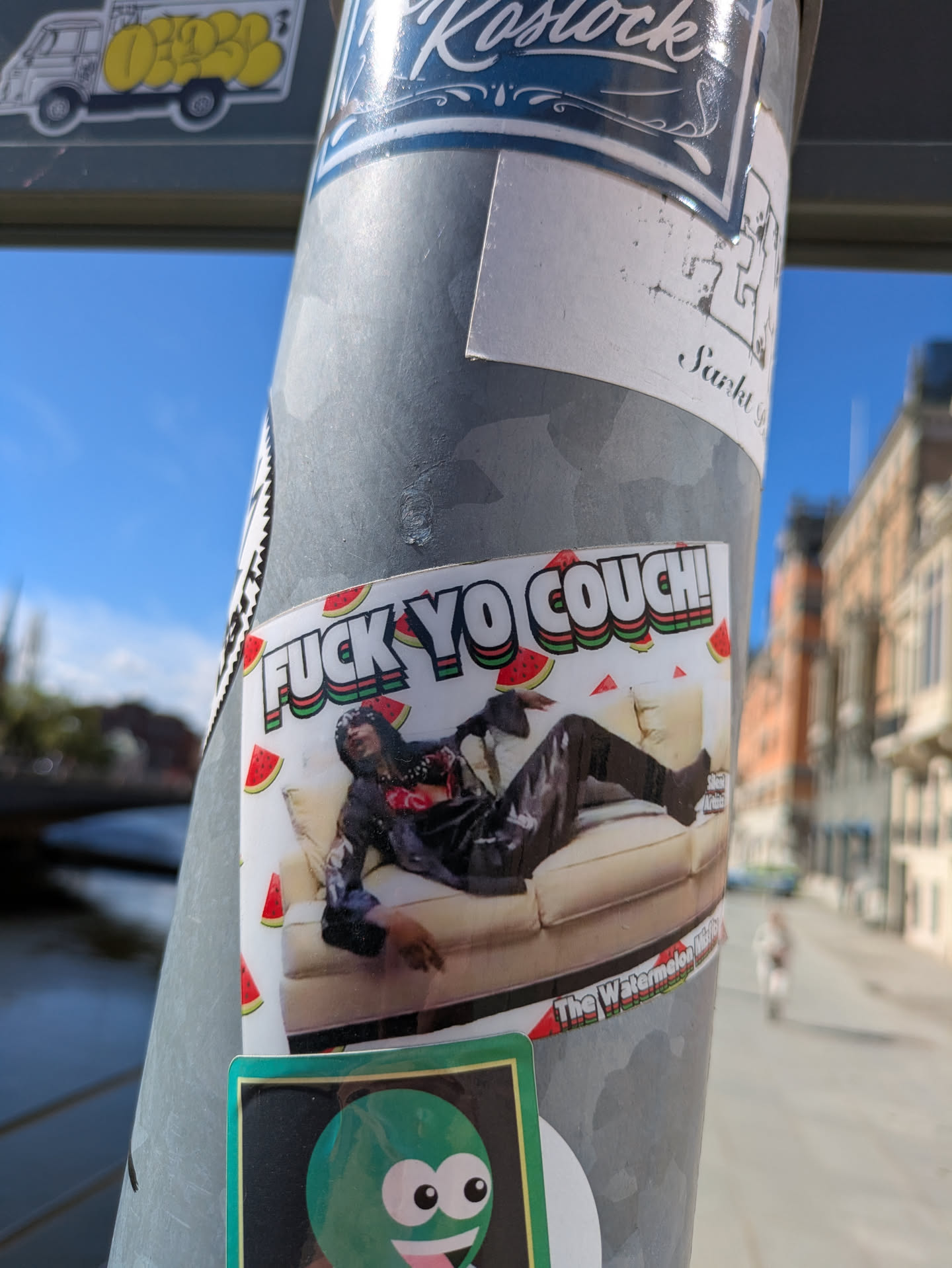 A rectangular sticker featuring a photo of Rick James reclining on a couch, with watermelons scattered around. The text says: "FUCK YO COUCH!" and "The Watermelon Album".