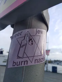 Street sticker A sticker depicting a Molotov cocktail inside a Star of David with the text "Queer Jews Burn Nazis".