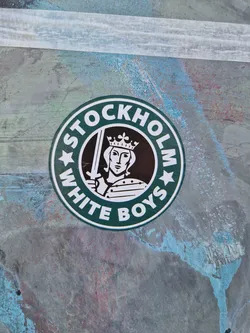 A round sticker in the style of a coffee shop logo, but instead of the coffee shop's logo, it has an image of a king and the text "Stockholm White Boys".