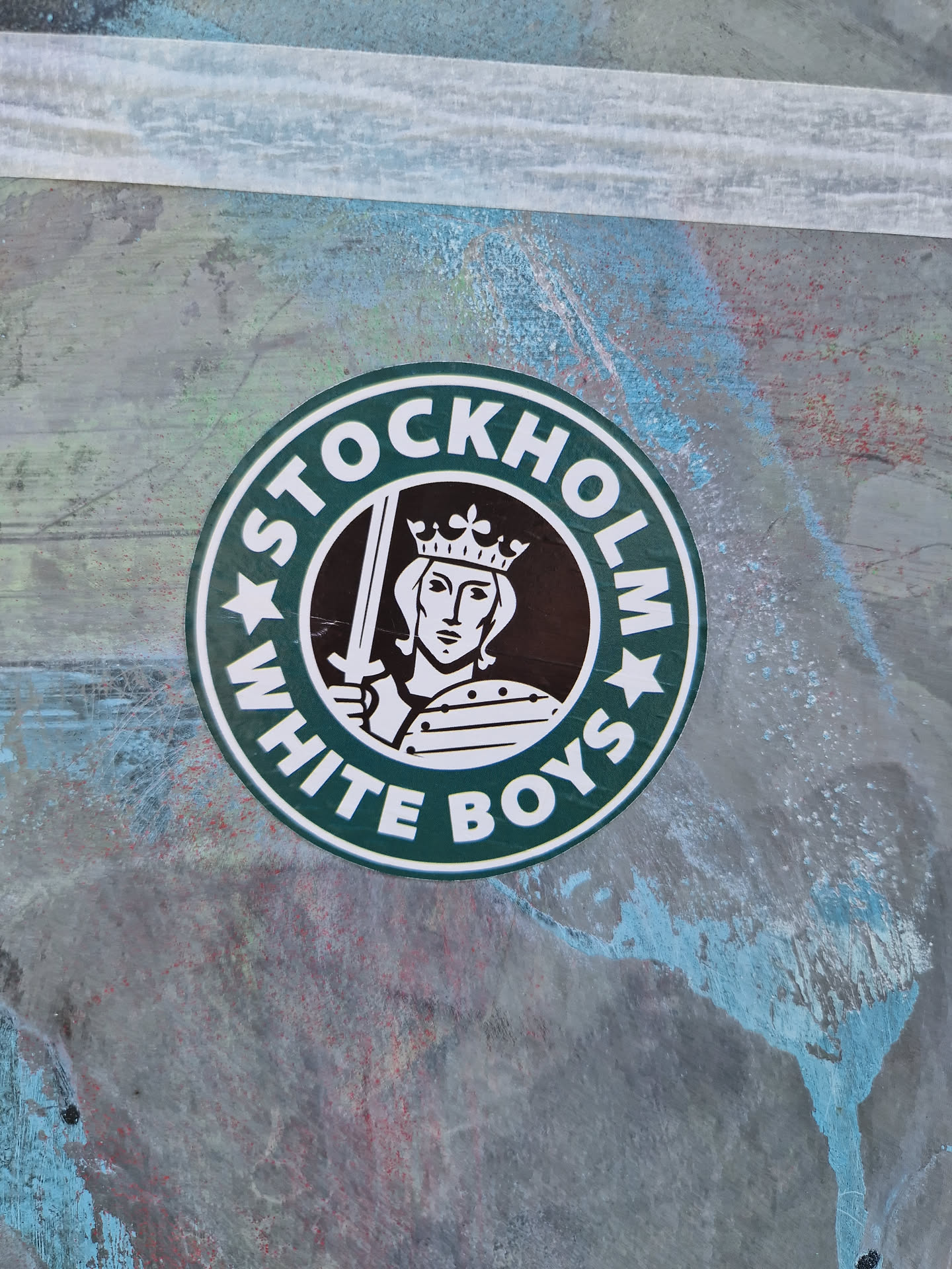A round sticker in the style of a coffee shop logo, but instead of the coffee shop's logo, it has an image of a king and the text "Stockholm White Boys".